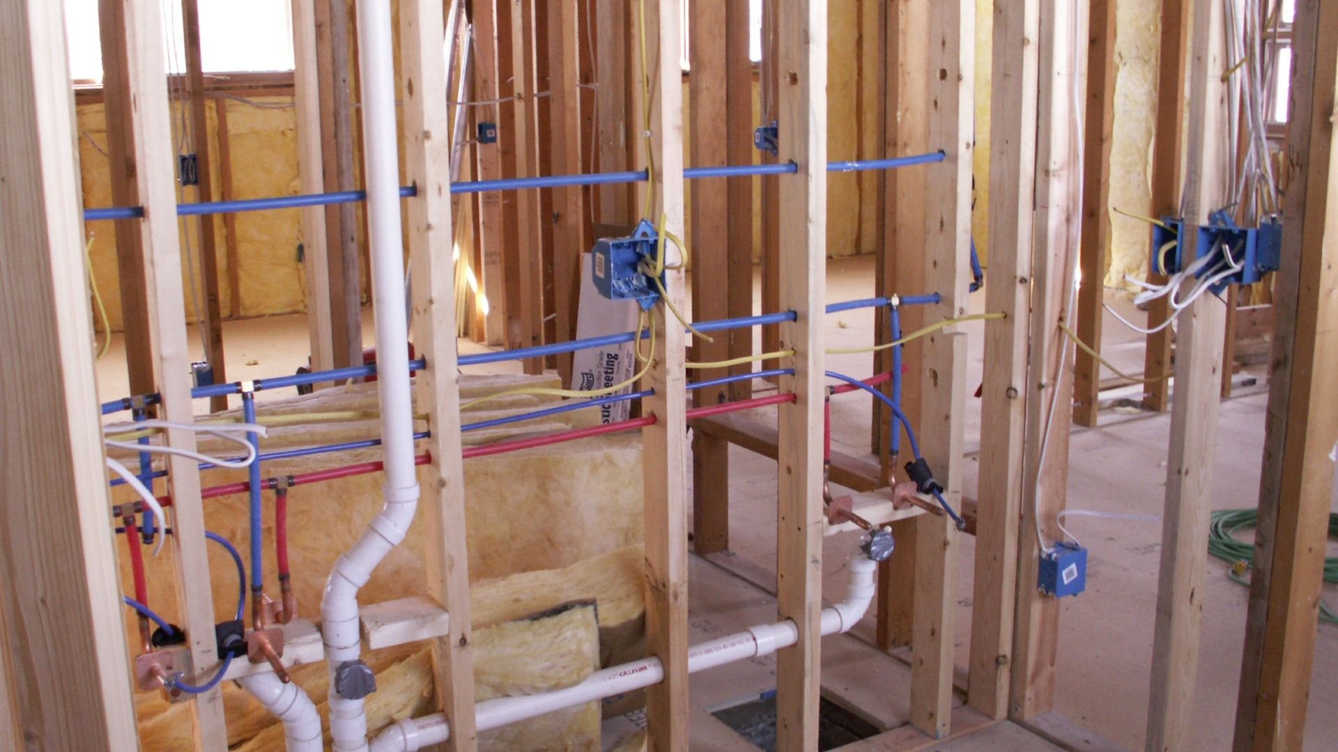 Plumbing and electrical work in progress during home construction