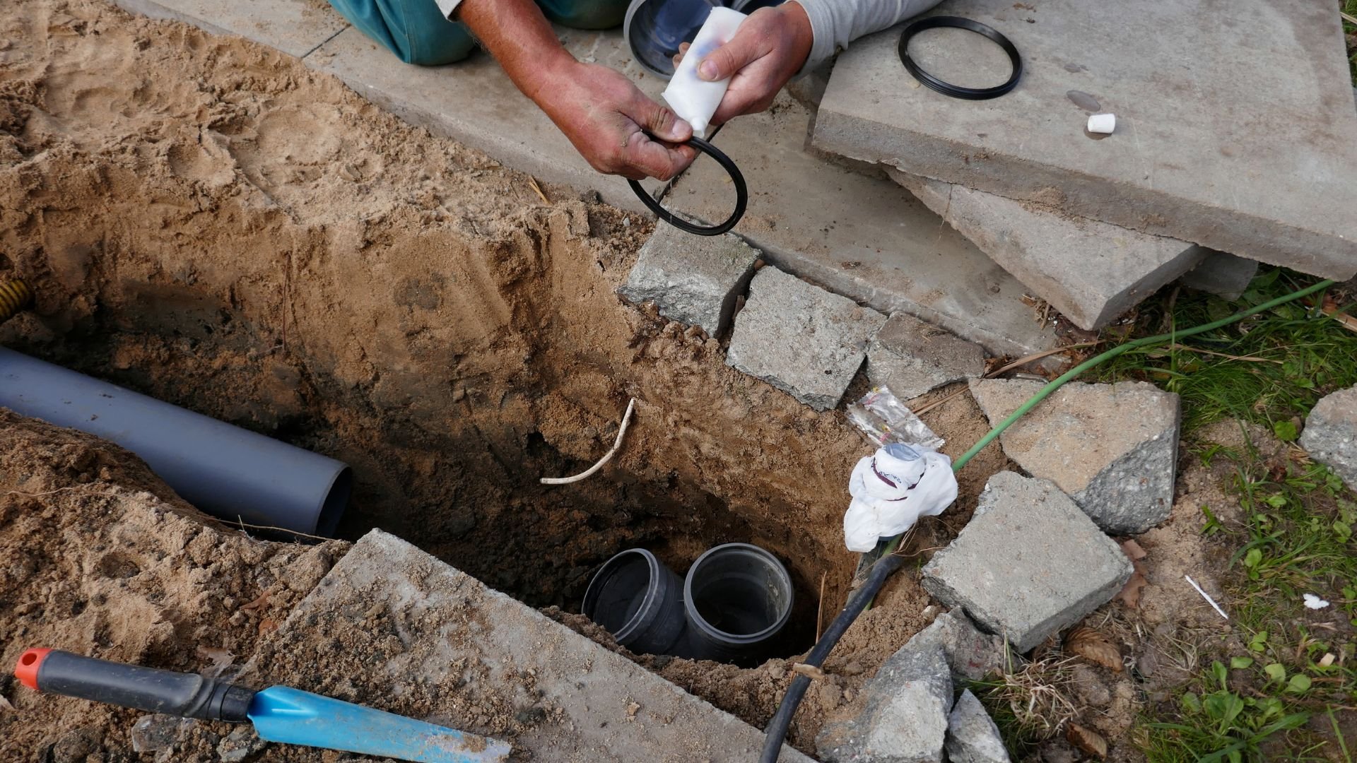 Installing underground pipes and connections during construction project